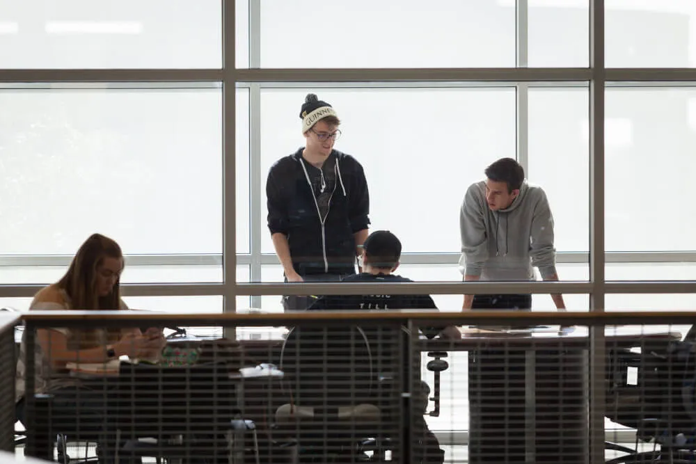 People around a table presumably having a business meeting.