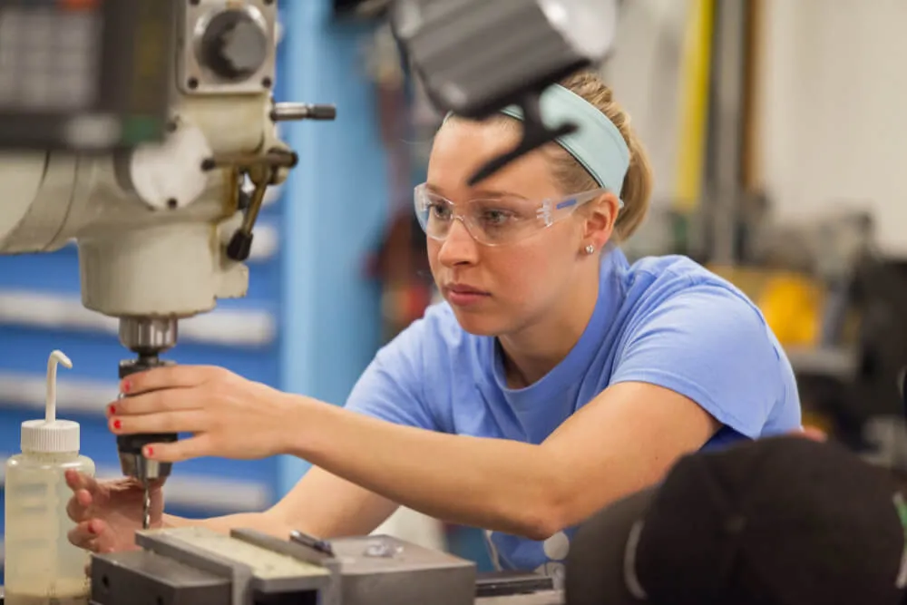 Student working in a machine shop.